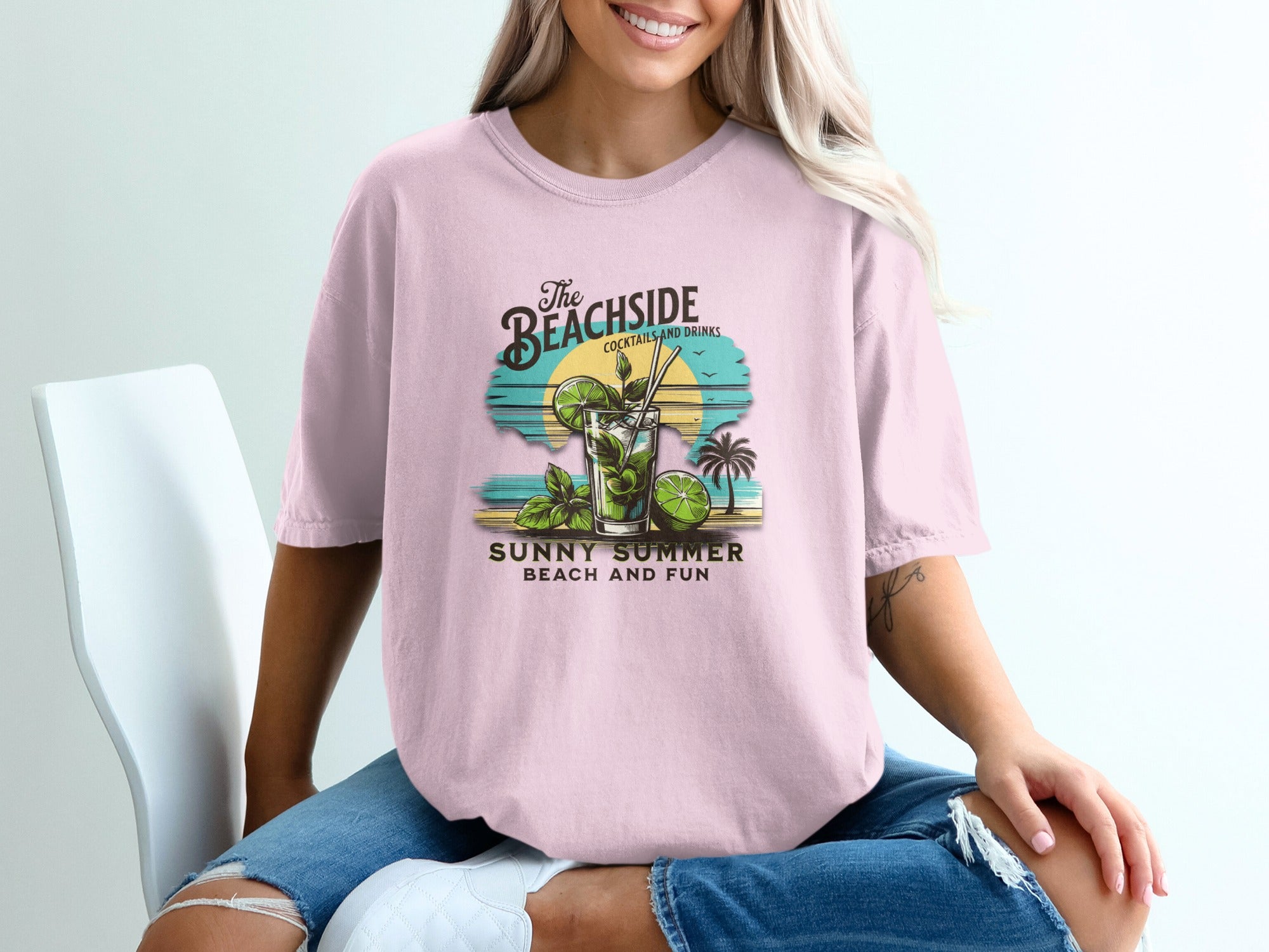T-shirt graphic with a cocktail, palm trees, sunset, and text "The Beachside", "Sunny Summer Beach and Fun".