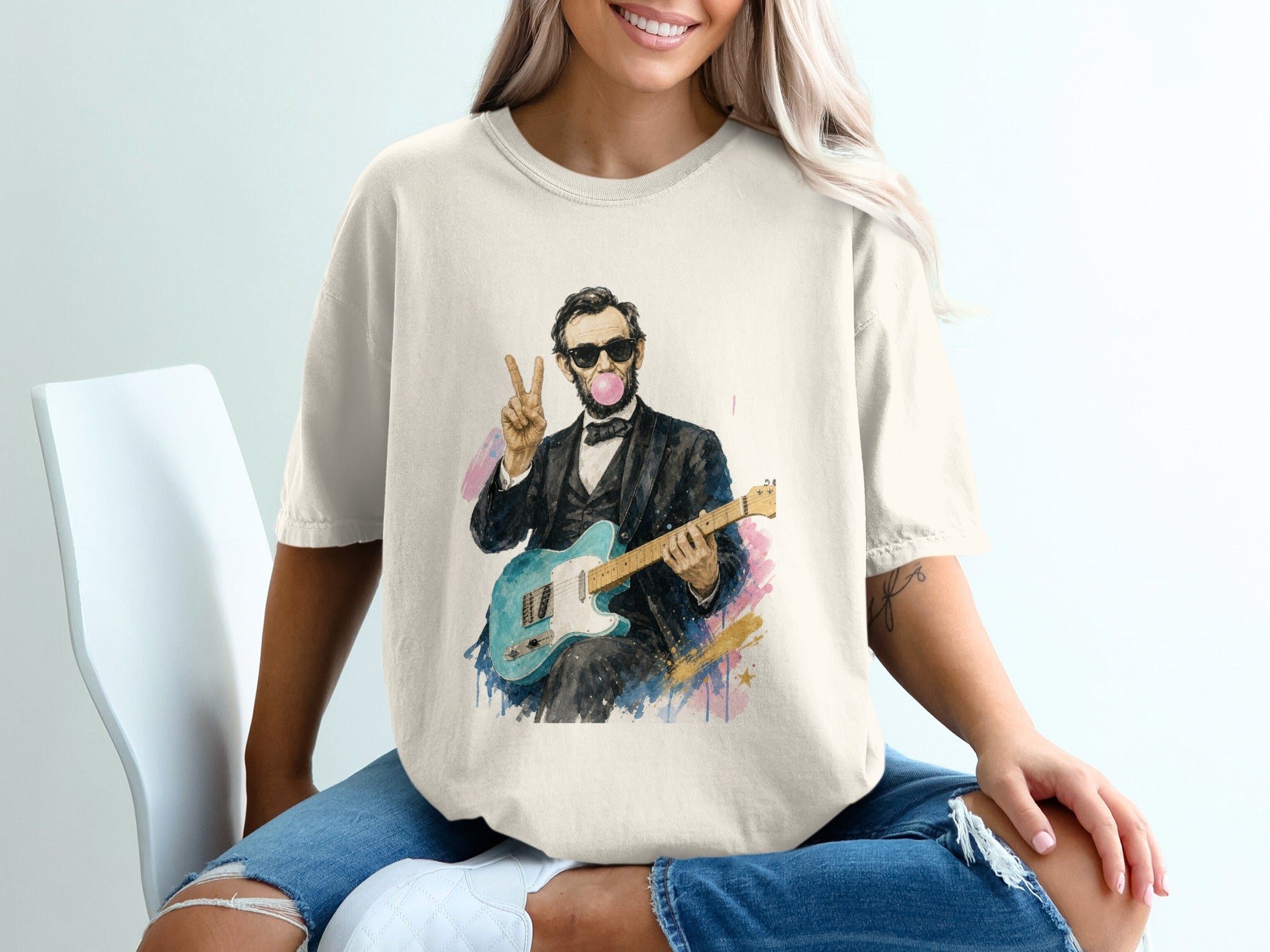 Abraham Lincoln in a suit playing a blue guitar, wearing sunglasses and blowing a bubble.