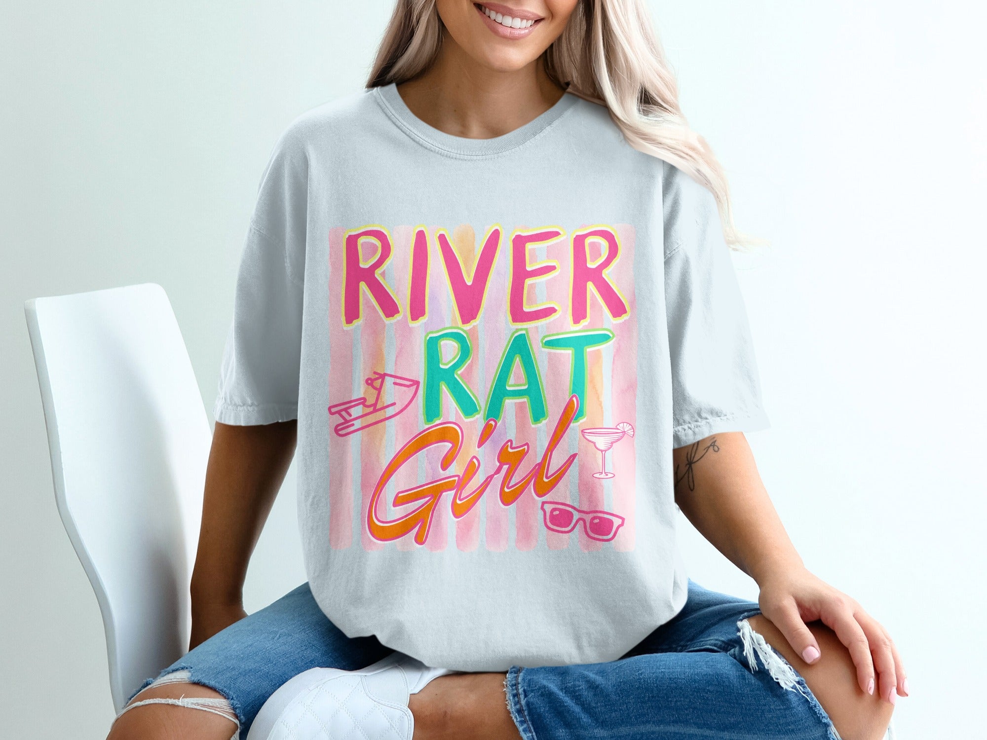Light blue t-shirt with "RIVER RAT Girl" text and summer icons.