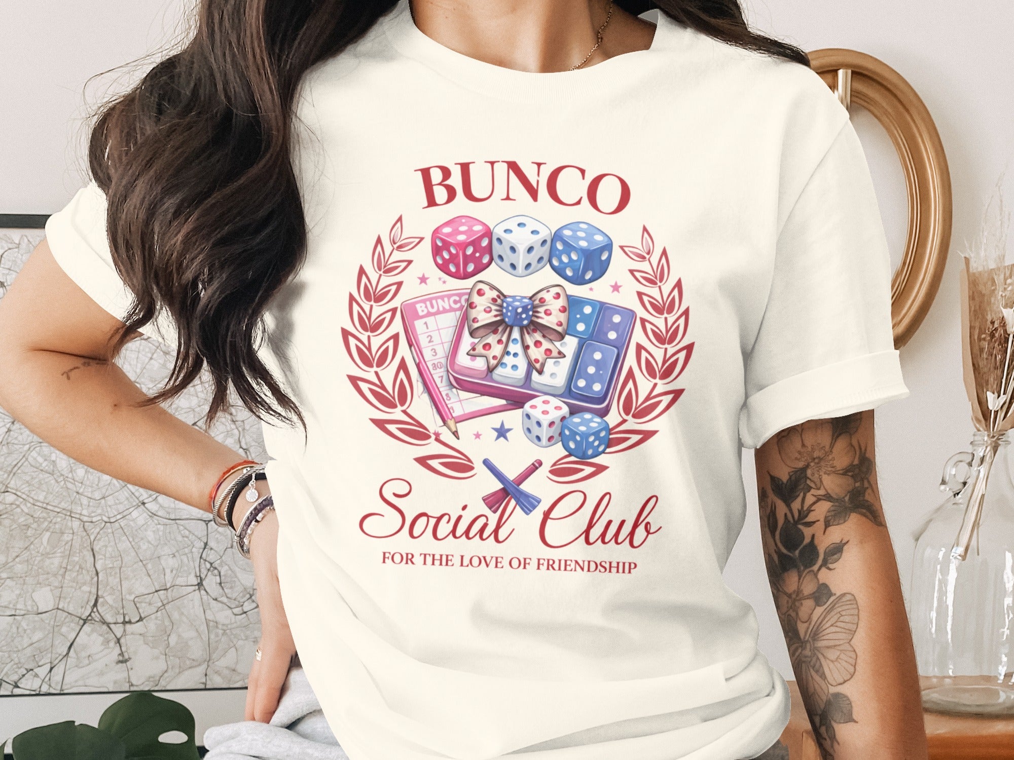 Bunco Social Club graphic on a cream t-shirt with dice and a score card.