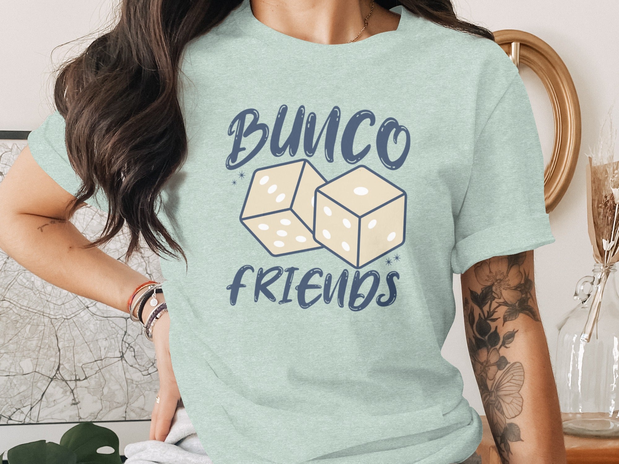 Light blue t-shirt with "Bunco Friends" text and two light yellow dice graphic.