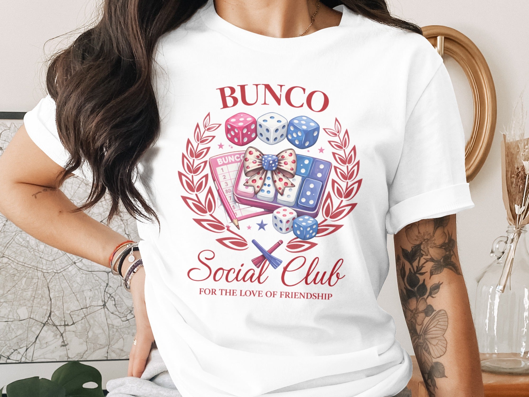 Bunco dice and scorecards with "Bunco Social Club" text on white t-shirt.