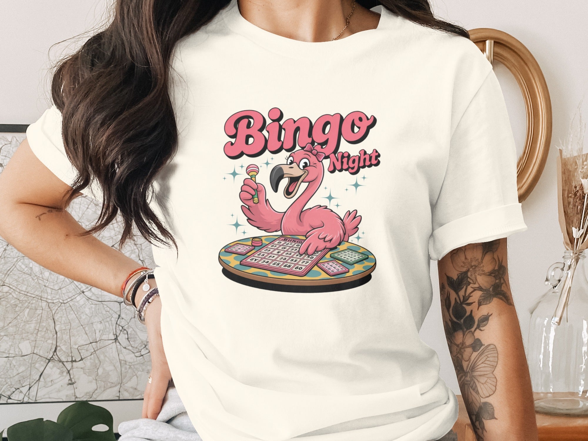 Flamingo with bingo cards and candy holding lollipop, text "Bingo Night".