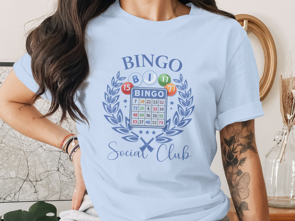 Light blue t-shirt with bingo graphic and "Social Club" text.