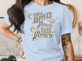 Light blue t-shirt with dice graphic and text "What Happens at Bunco Stays at Bunco".
