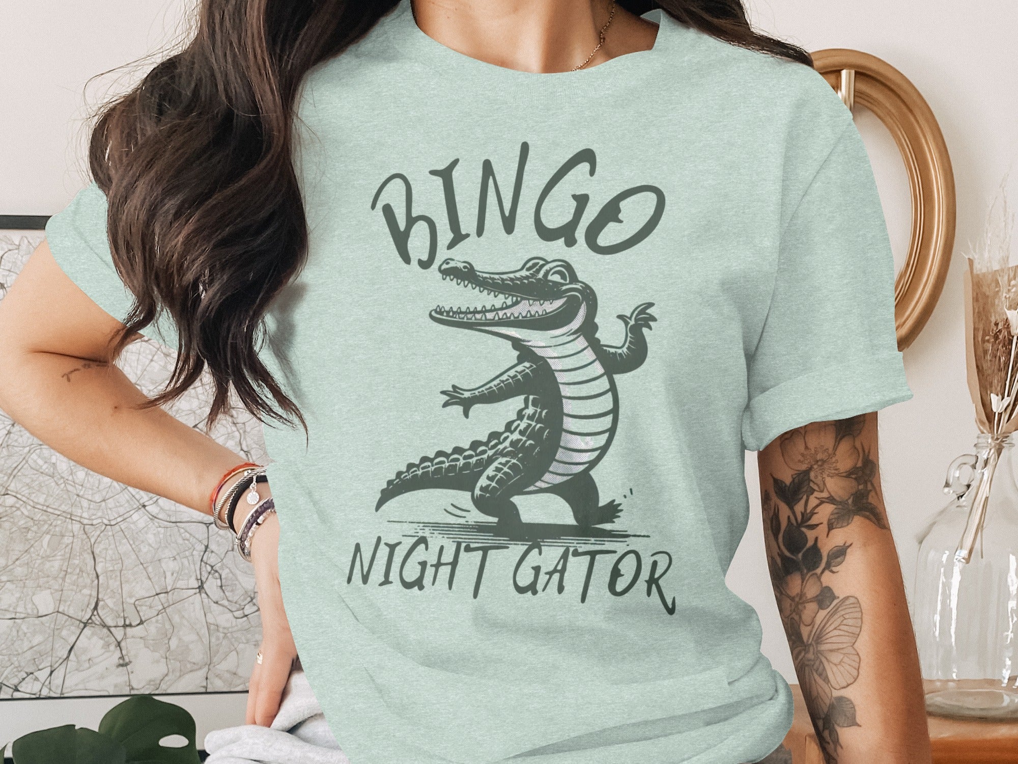 Light green t-shirt with cartoon alligator and text "BINGO NIGHT GATOR".
