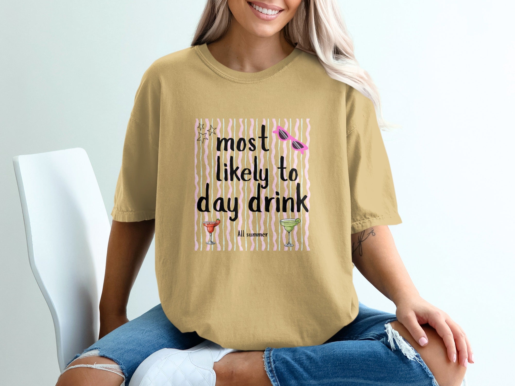 Gold t-shirt with graphic that reads "most likely to day drink All summer".