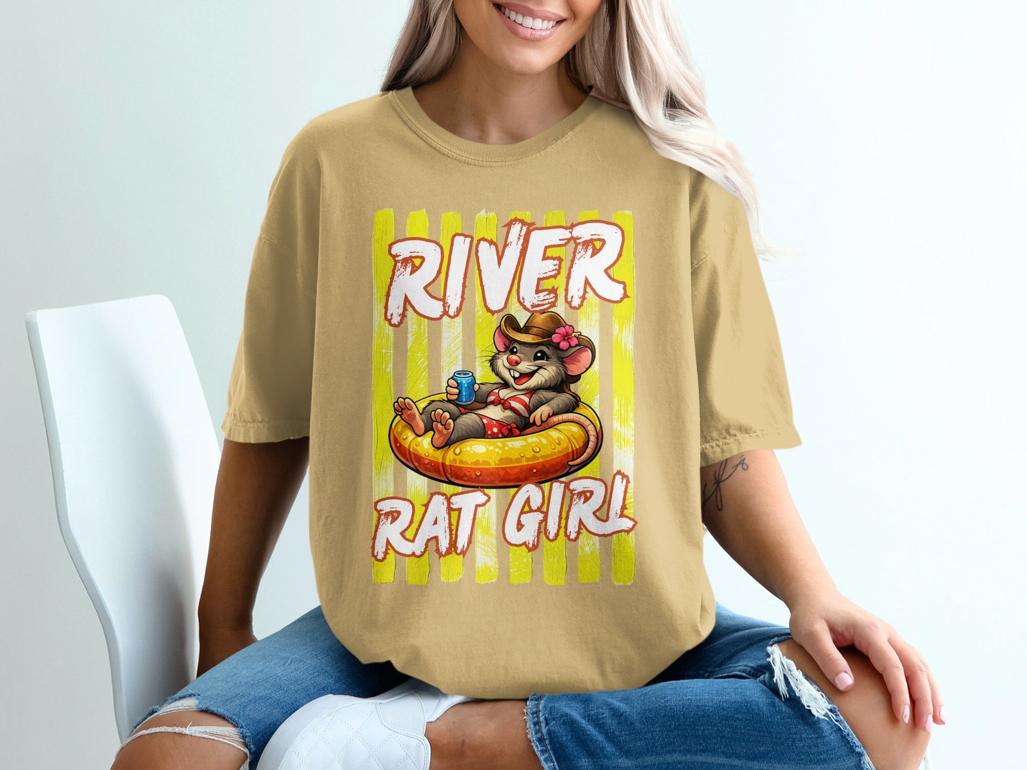T-shirt graphic with cartoon mouse in inner tube with text "RIVER RAT GIRL".