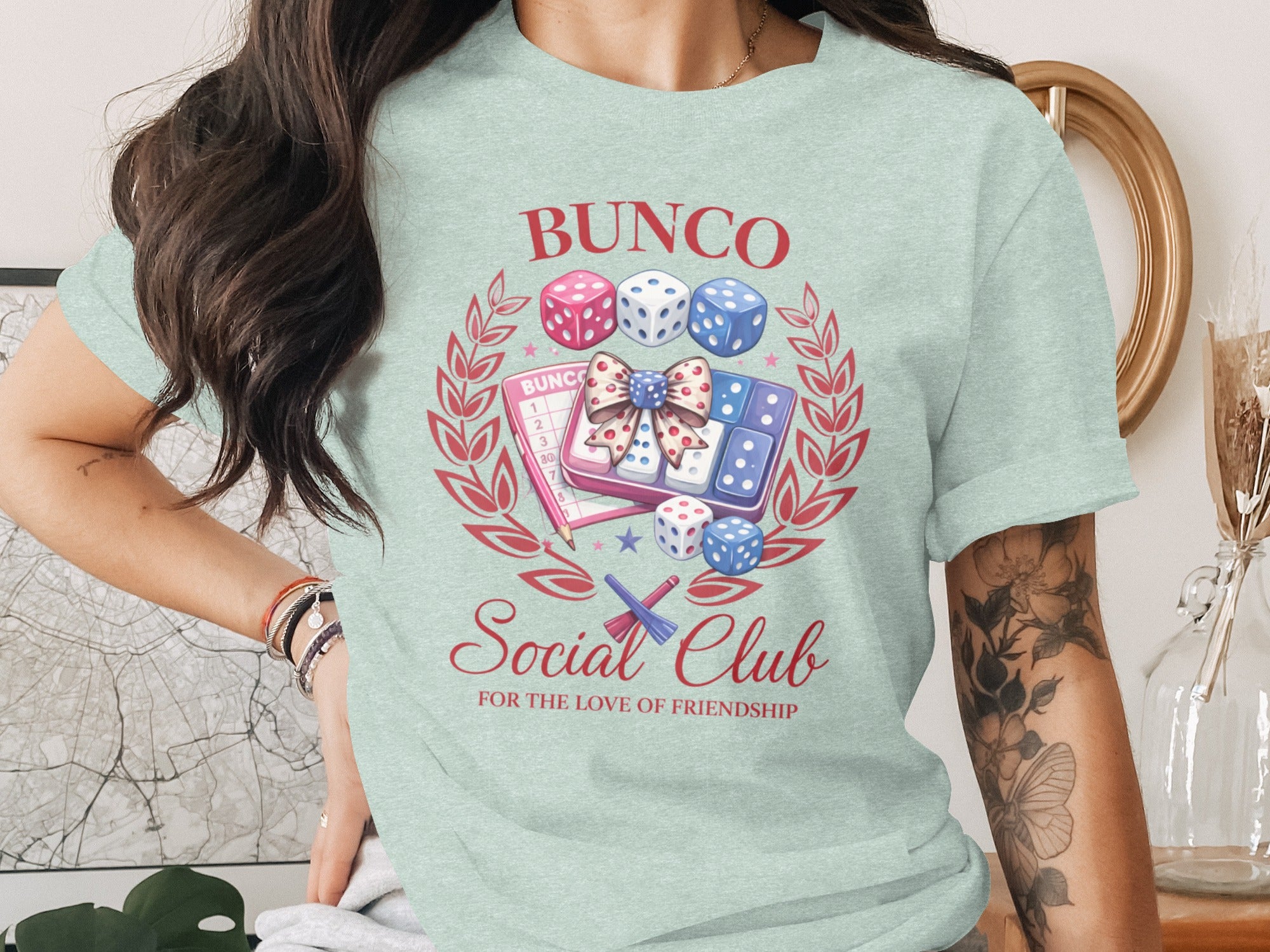Bunco Social Club tee with dice, scorecards, and laurel wreath design.