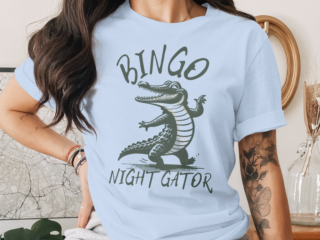 Light blue t-shirt with a cartoon alligator and the text "BINGO NIGHT GATOR".