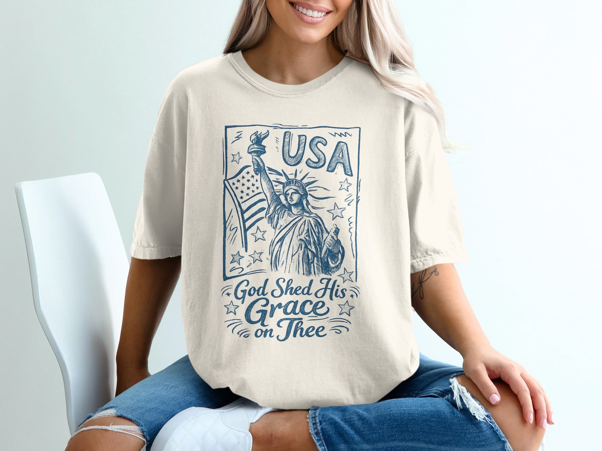 T-shirt with Statue of Liberty and "USA God Shed His Grace on Thee" text.