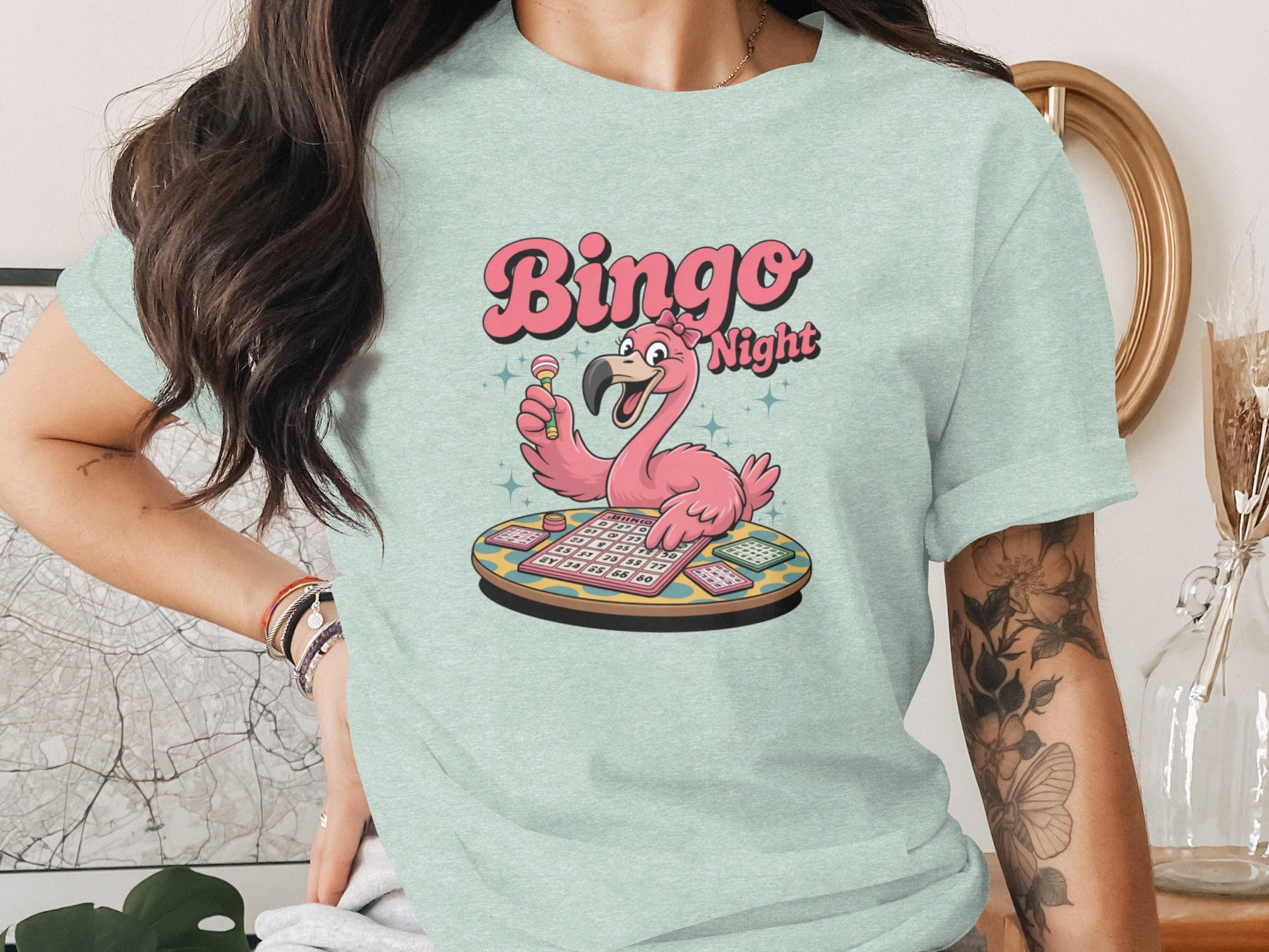 Cute flamingo playing bingo on a table with a bingo card.