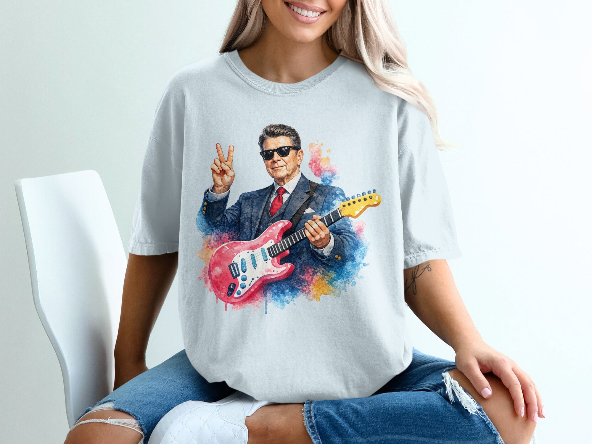 Watercolor portrait of a man in a suit holding a pink electric guitar.