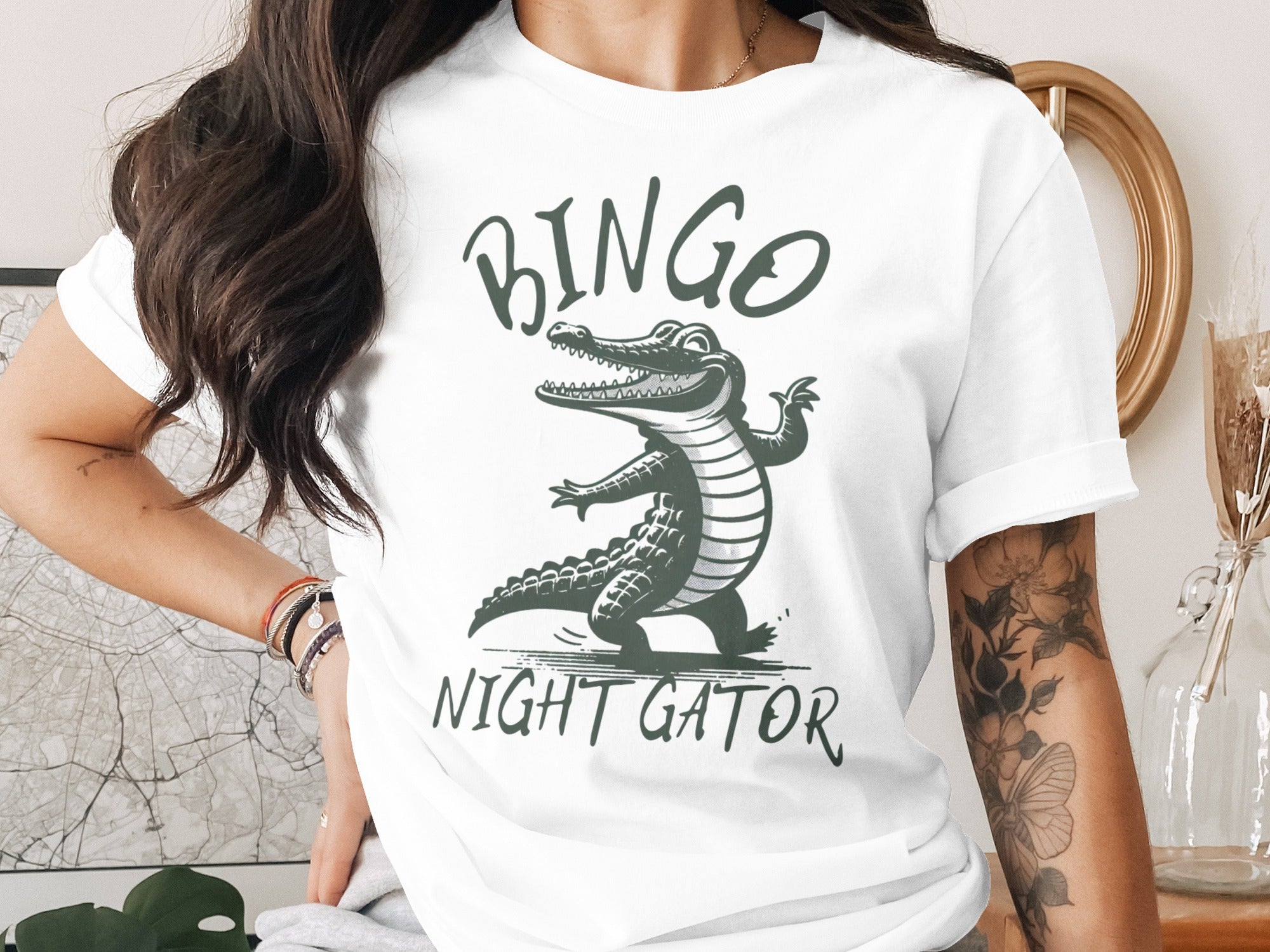 White t-shirt with green text "BINGO NIGHT GATOR" and a dancing alligator graphic.