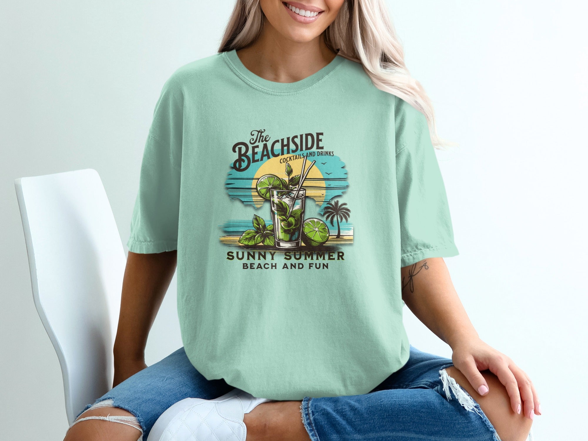 Mint green t-shirt with "The Beachside Cocktails and Drinks" graphic.