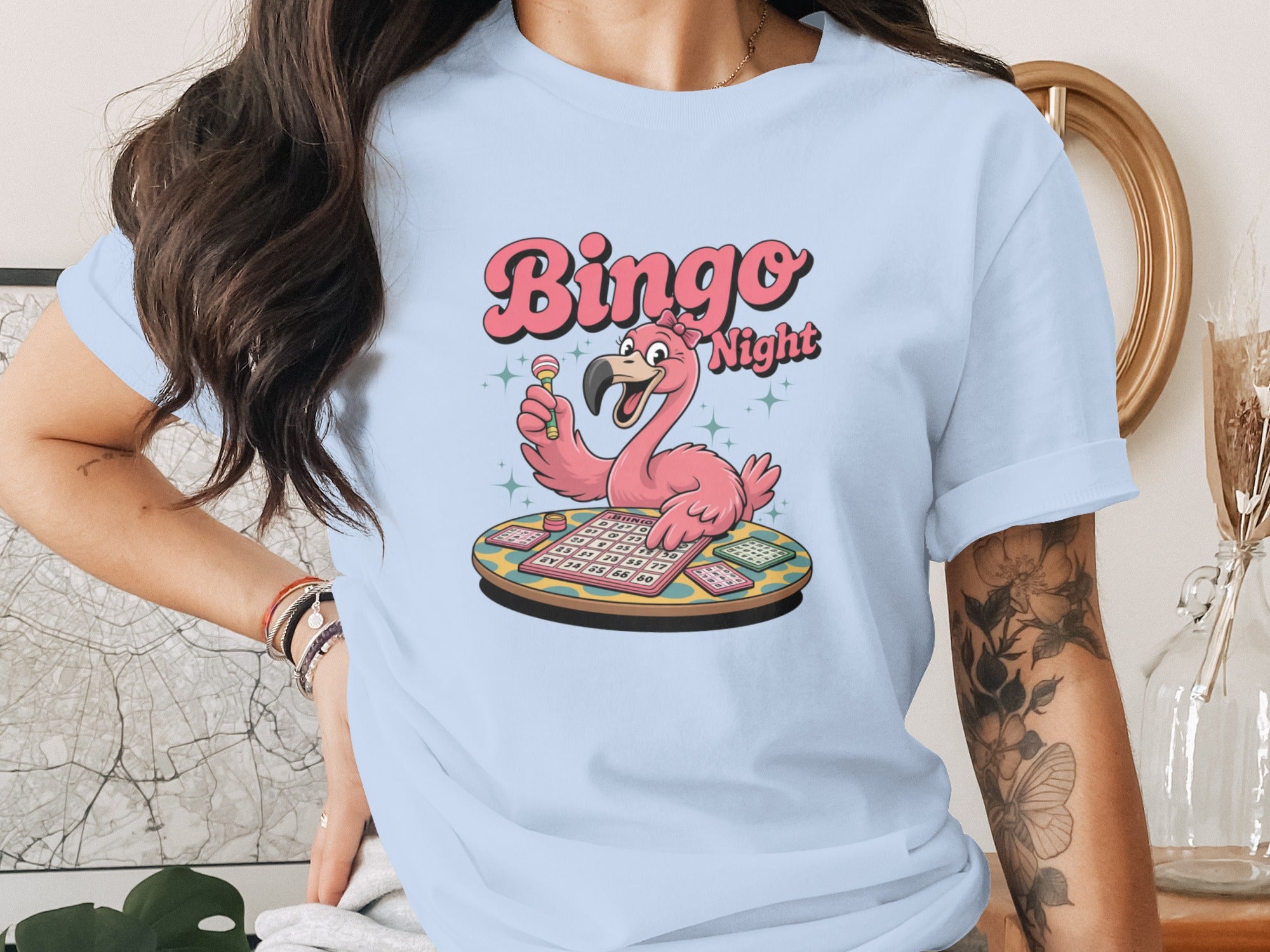 Light blue t-shirt featuring a cartoon flamingo and "Bingo Night" text.