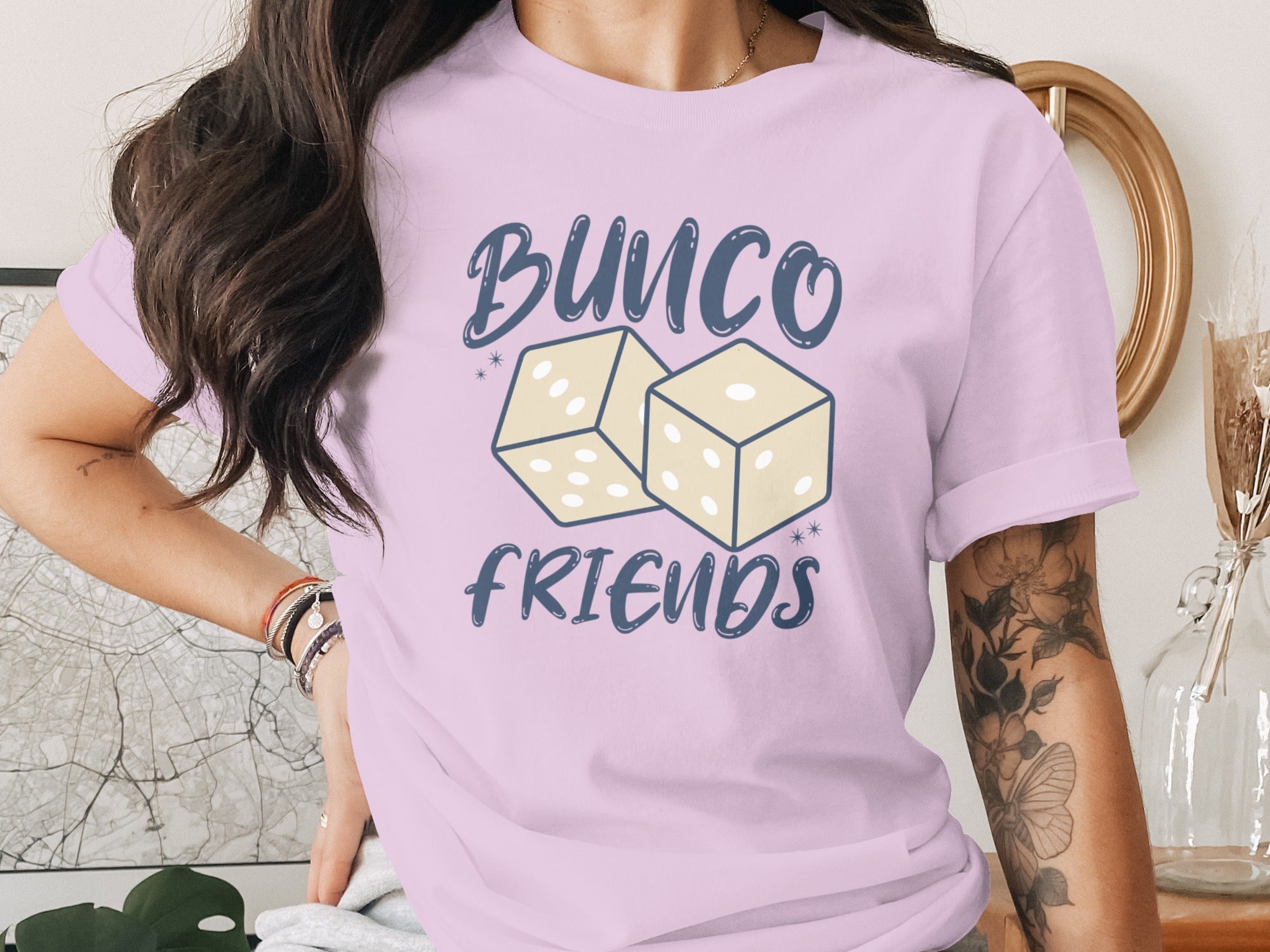 Bunco Friends graphic with two dice on a pink t-shirt.