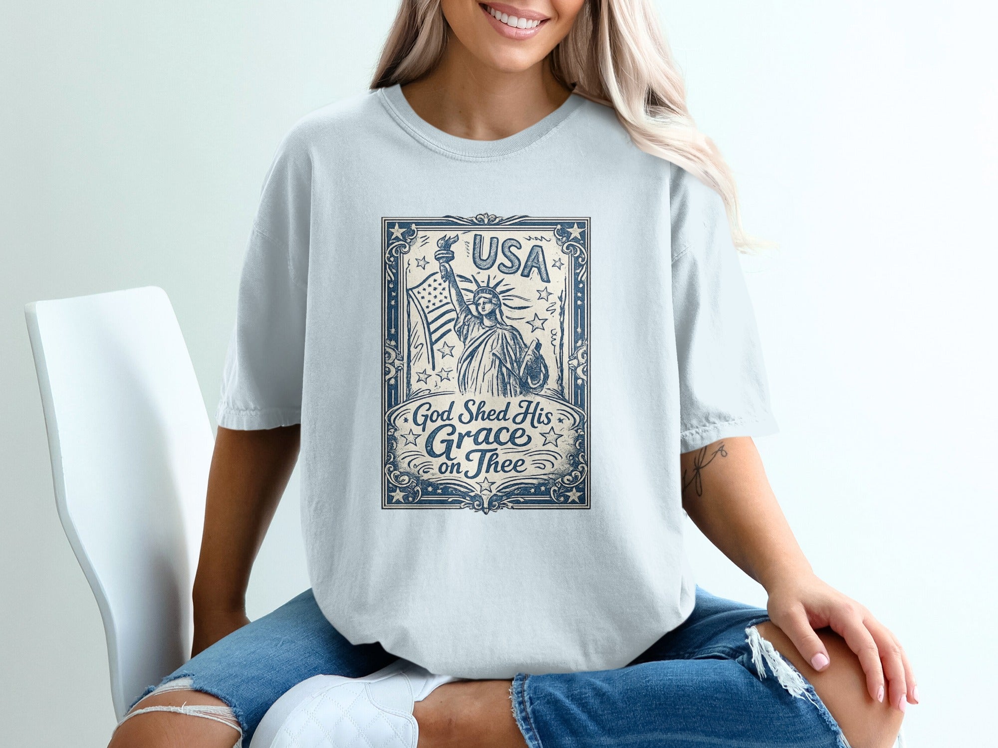 T-shirt with Statue of Liberty and "USA God Shed His Grace on Thee" text.
