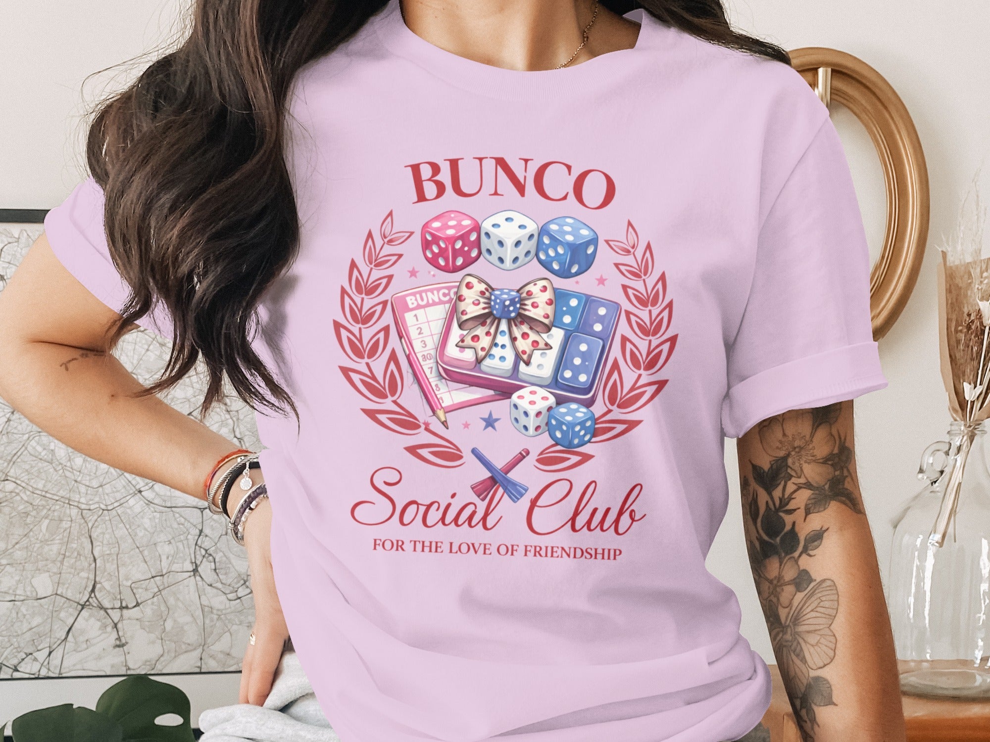 Bunco Social Club shirt with dice, scoring cards, pencil, and bow design.