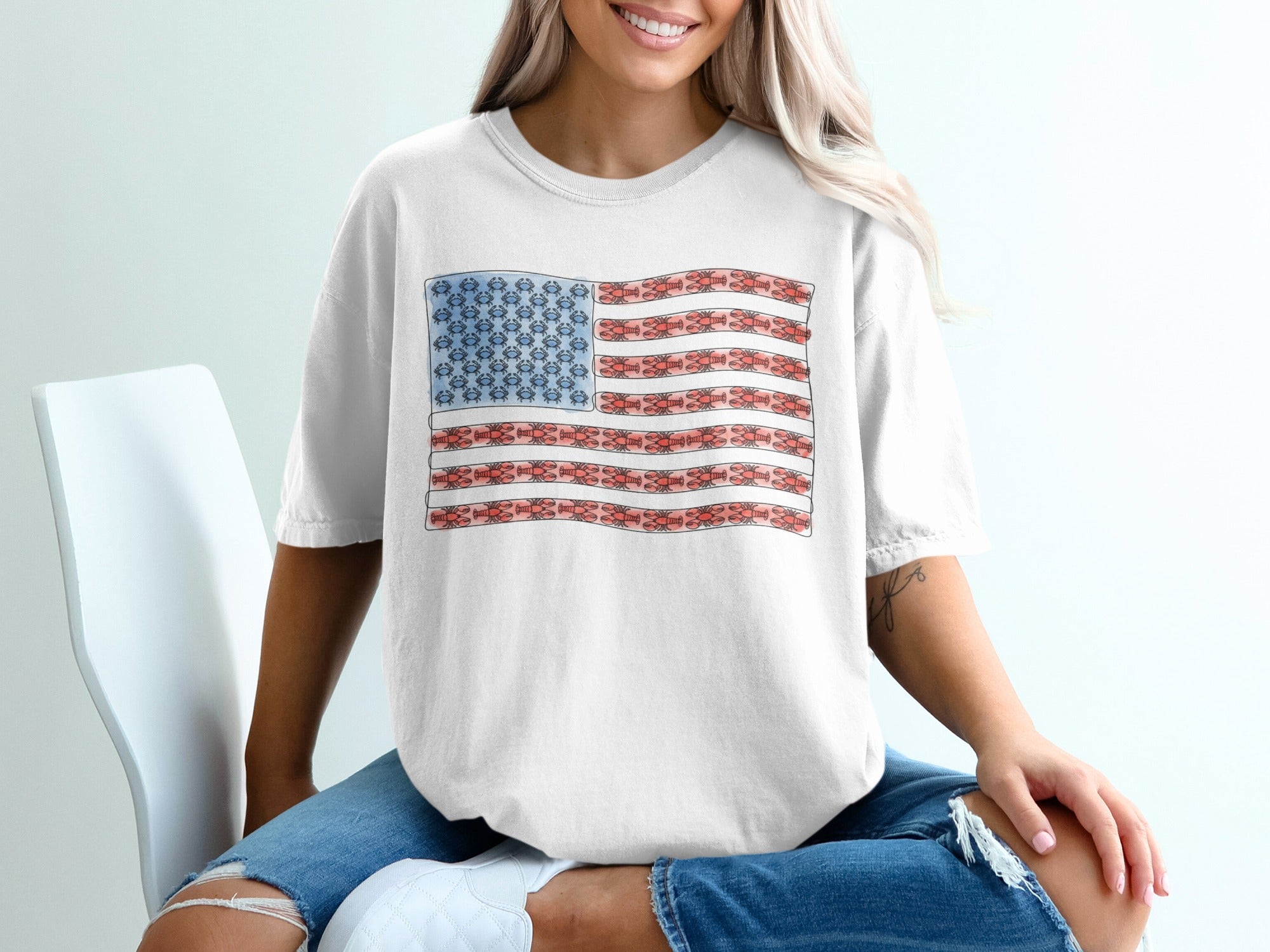 White t-shirt with an American flag design made of cartoonish molecules.