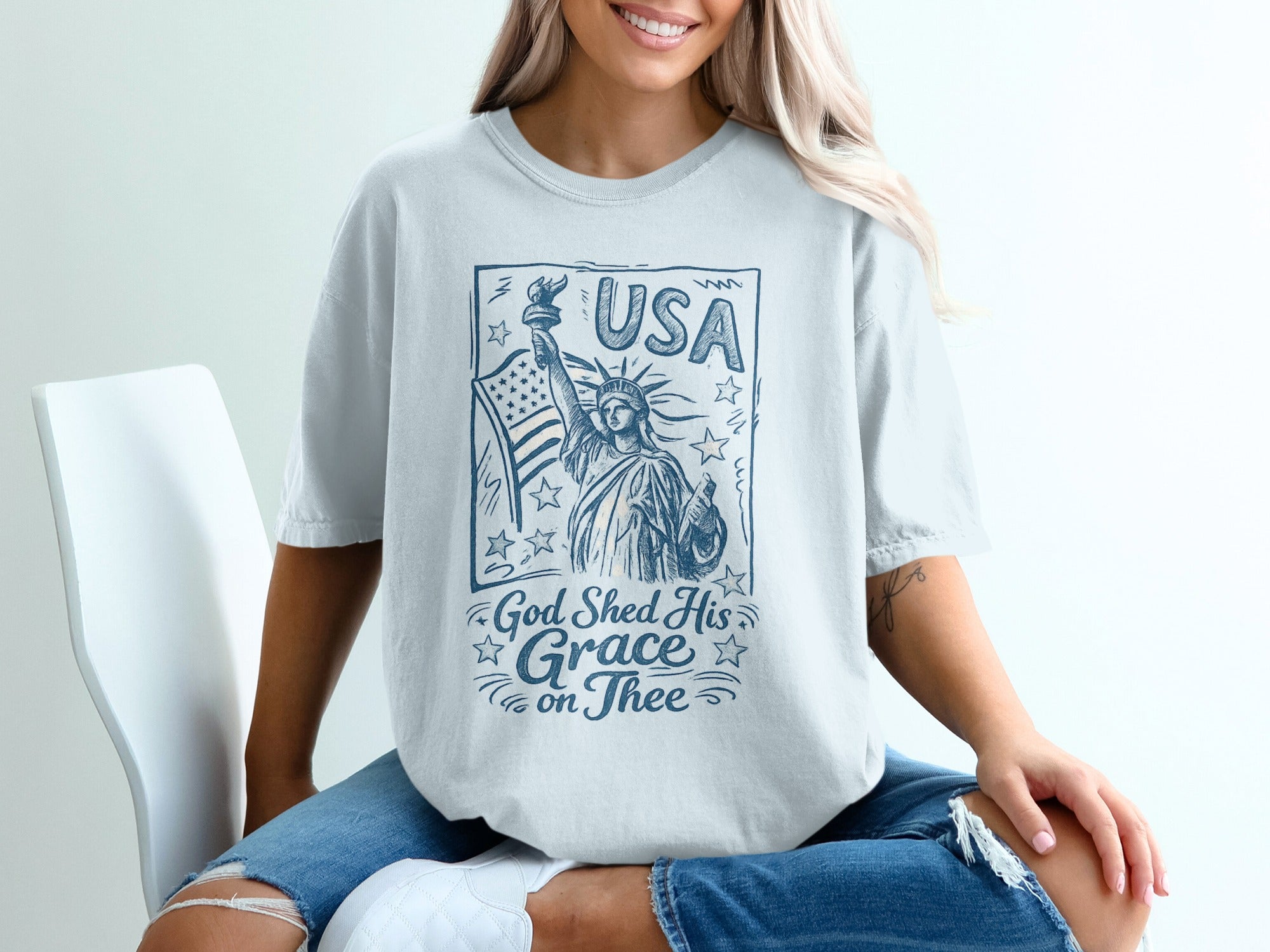T-shirt with Statue of Liberty, USA, and "God Shed His Grace on Thee" text.