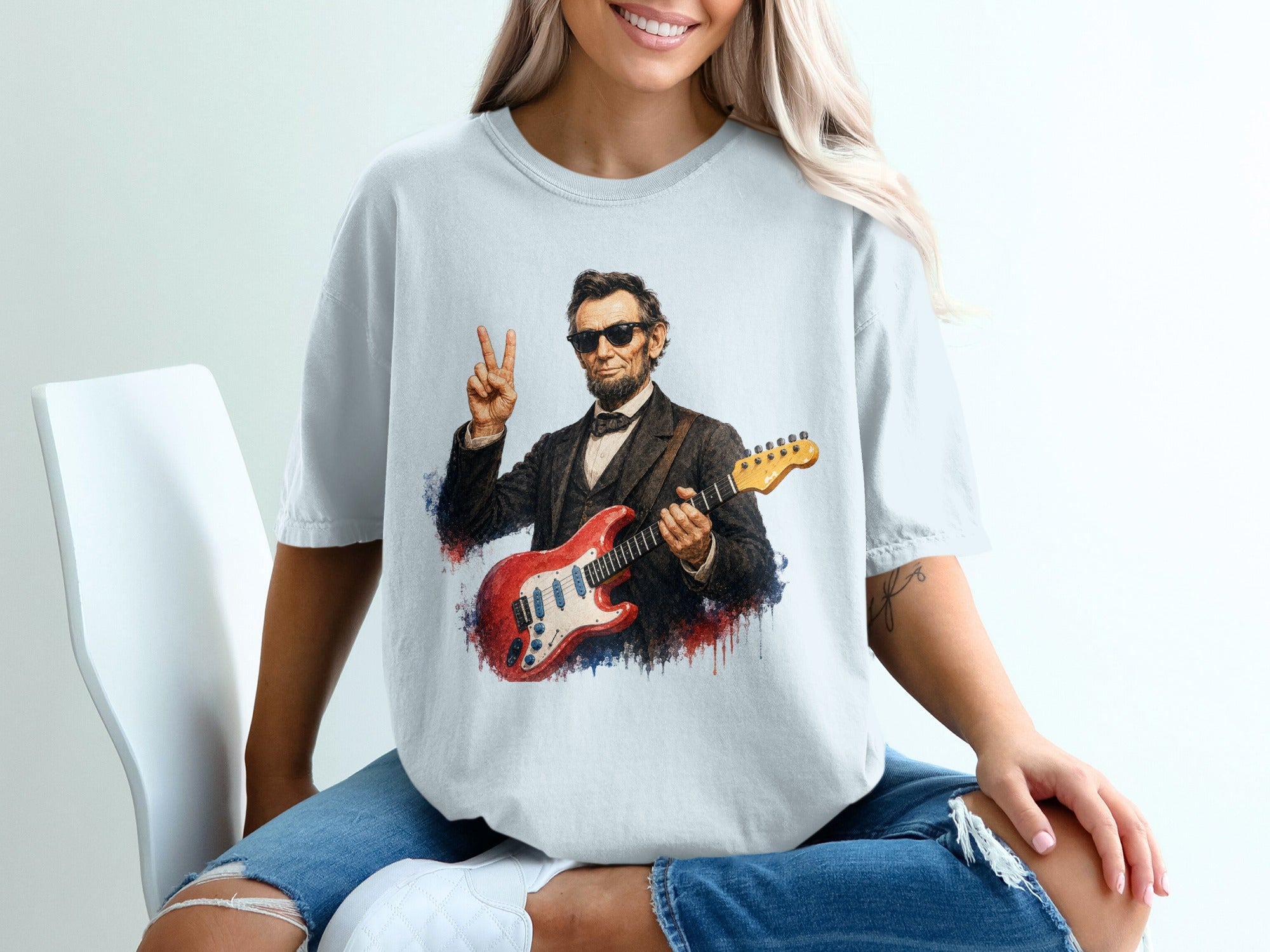 Abraham Lincoln wearing sunglasses, holding a red electric guitar, and making peace sign.