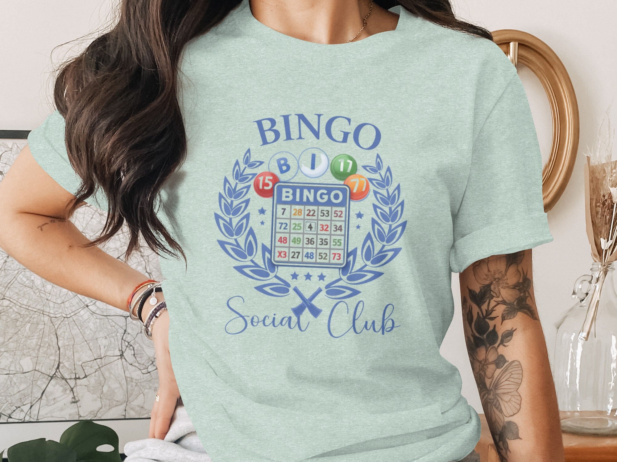 Light blue t-shirt with a Bingo card graphic and "Bingo Social Club" text.