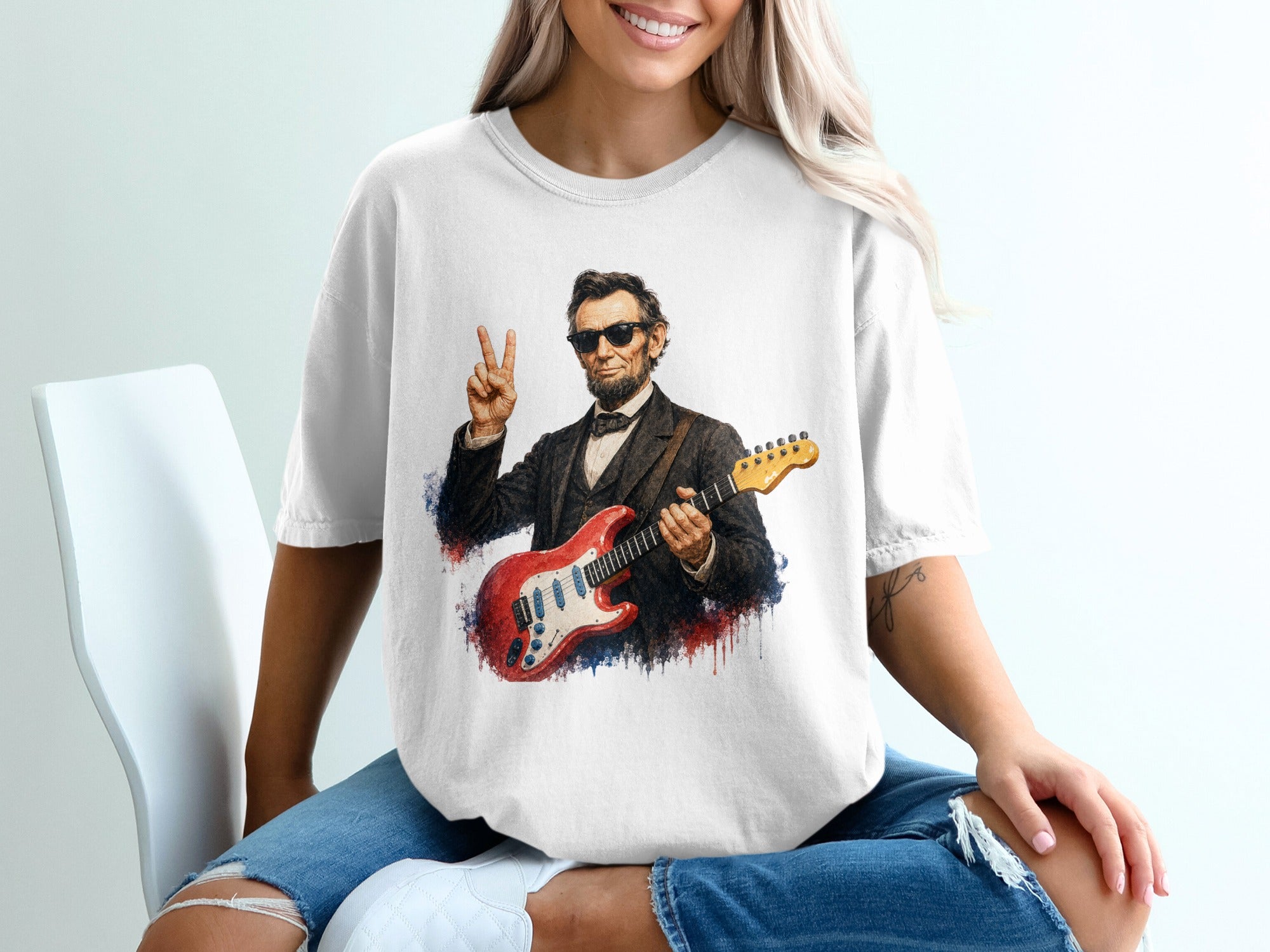 Abraham Lincoln wearing sunglasses, holding a red electric guitar, and giving a peace sign.