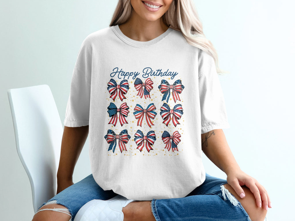 White t-shirt with nine patriotic birthday bows and "Happy Birthday" text.
