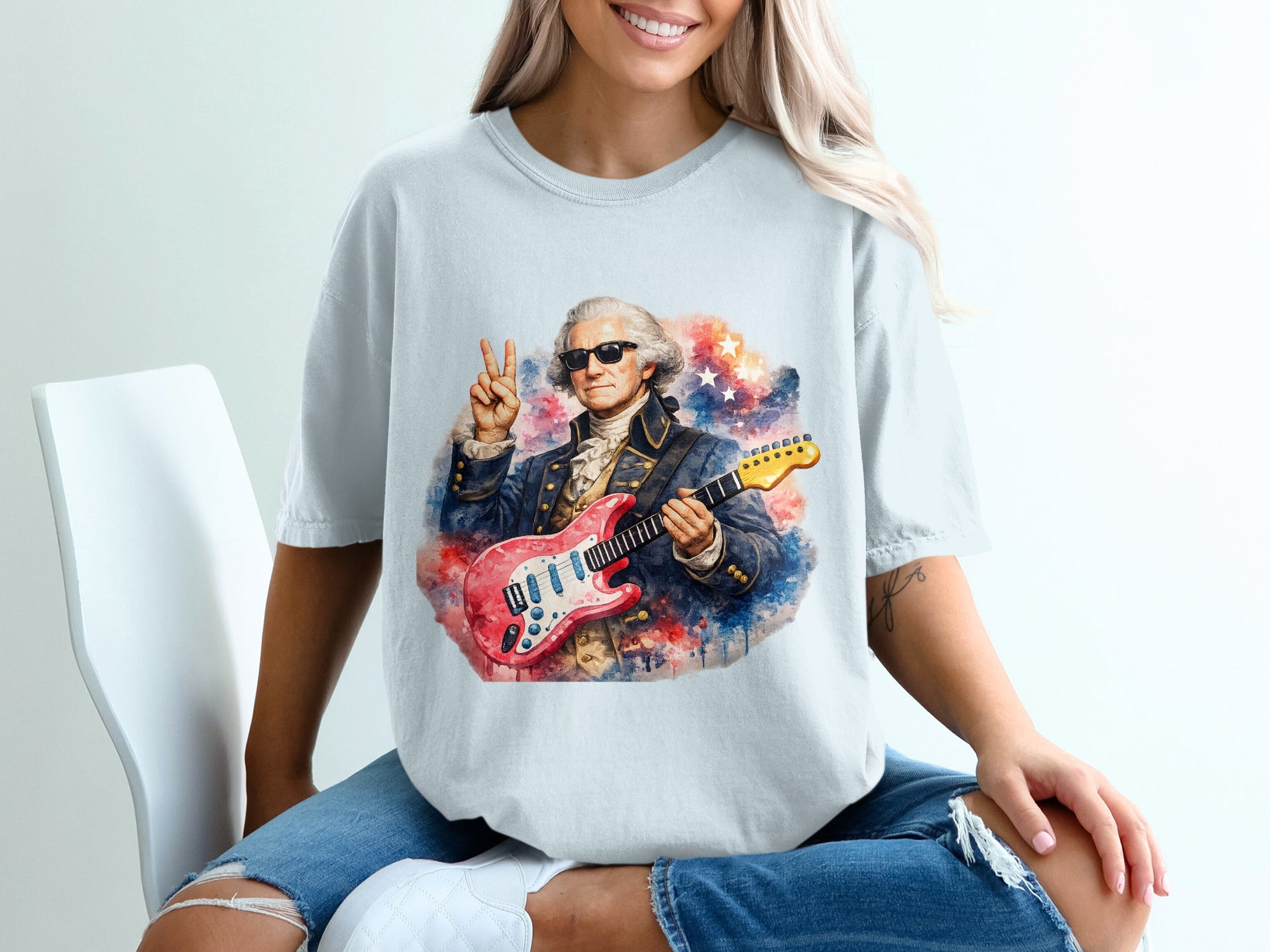 George Washington in sunglasses, holding a guitar, and giving a peace sign.