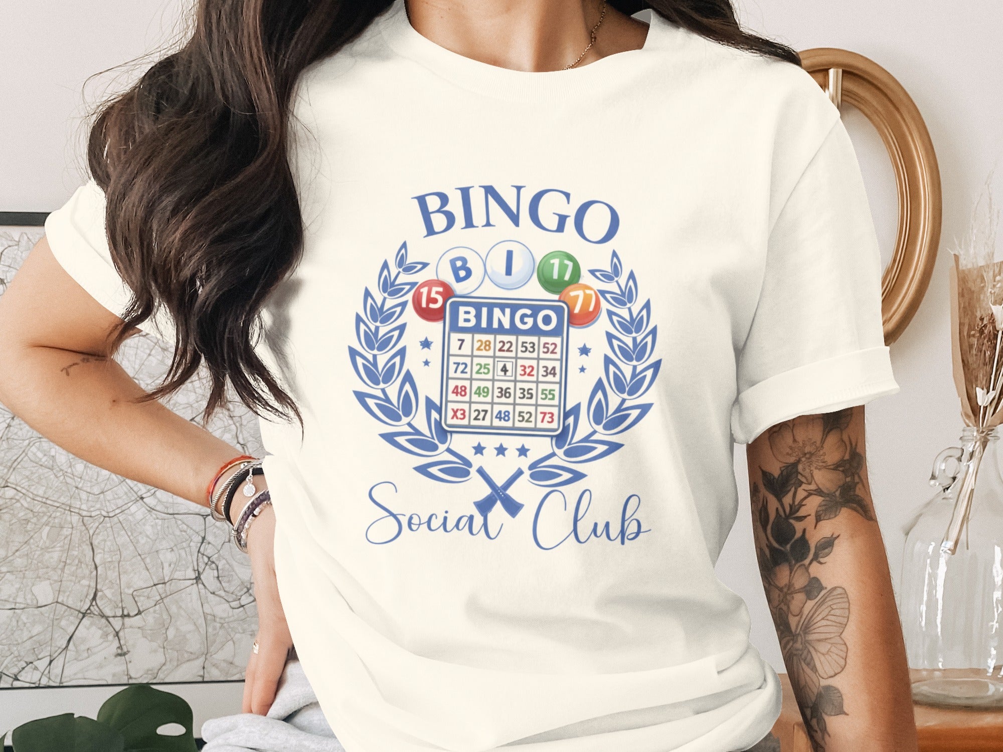 Cream t-shirt with blue bingo graphic and "Bingo Social Club" text.